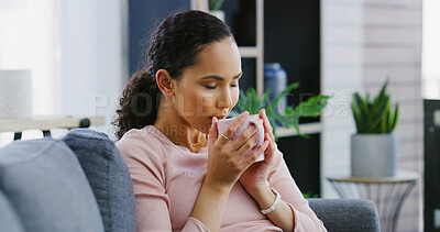 Buy stock photo Coffee, calm and woman on sofa in house with relax, peaceful or morning on weekend break. Happy, tea and female person drinking warm beverage, smile and resting on couch in living room at apartment.