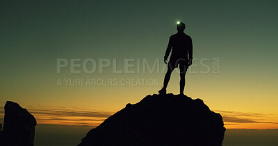 Buy stock photo Night, rock climber and person in nature, adventure and silhouette on cliff with headlamp and space. Outdoor, hiking and athlete on mountain for fitness, sunset and light for exploration in dark