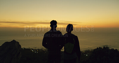 Buy stock photo Silhouette, couple and night with ocean view on mountain for hiking, fitness or outdoor exercise. Back, people or watching sunset on cliff for dawn, trekking journey or adventure on mockup space