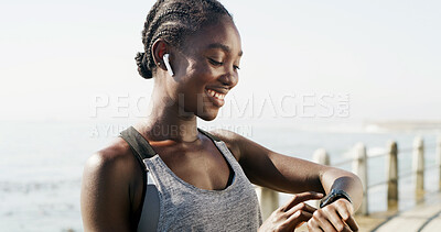 Buy stock photo Black woman, fitness or beach with smart watch for heart rate, step counter or pulse in nature. Active, female person or runner checking wristwatch for workout goals or exercise schedule on promenade