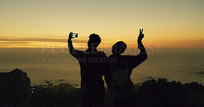 Buy stock photo Couple, selfie and hiking at sunset with ocean view, peace sign and outdoor with celebration on web. People, silhouette and photography with memory, fitness and post on social media on mountain