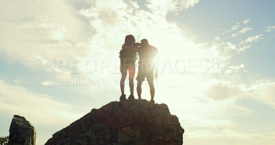 Buy stock photo Cliff, hiking and hug with couple in nature for trekking, adventure and summer vacation. Explore, backpacking and mountain summit with people outdoor for sunrise, freedom and holiday tourism