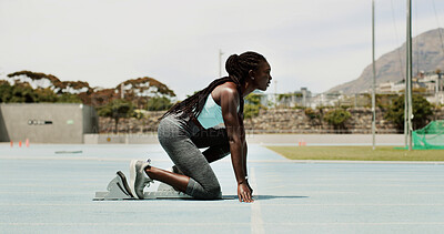 Buy stock photo Black woman, runner and training with starting blocks, track or profile for launch, speed and race. Person, girl and athlete at line for exercise, workout or fitness routine at sports club in Jamaica