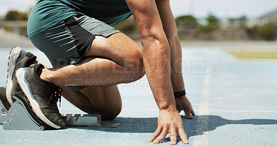 Running, ready and legs of man on race track for fitness, competition practice and workout. Begin, marathon challenge and starting block with person in stadium for exercise, training and cardio