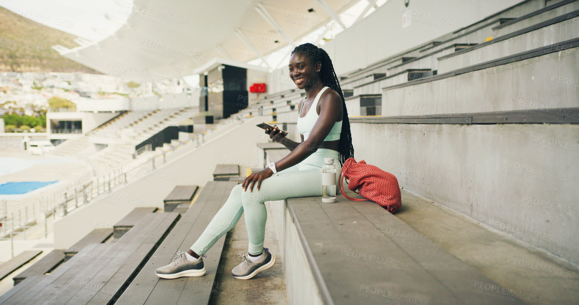 Buy stock photo Athlete, think and woman with smartphone, stadium or  sportswear for fitness, calm or workout break. Outdoor, runner and plan for marathon, wellness and black person with mobile, wonder or reflection