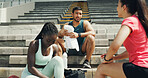 Stadium, friends and towel with break for fitness, achievement and running support. Outdoor, athlete people and teamwork for marathon, training progress and exercise goals for workout rest on stairs
