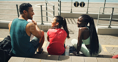 Buy stock photo Talking, friends and athlete in stadium for break, exercise or fitness for laughing or teamwork. Relax, back or happy people on steps for sports training with runners, conversation or healthy workout