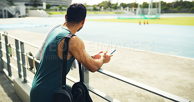 Buy stock photo Fitness, athlete and man with smartphone, stadium and calm with sportswear, think and workout break. Outdoor, runner and planning for marathon, wellness and person with mobile, wonder or reflection