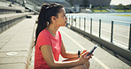 Athlete, woman and thinking with phone at stadium for social media, fitness app and event agenda. Female person, resting and mobile for texting, sports progress results and information for tournament
