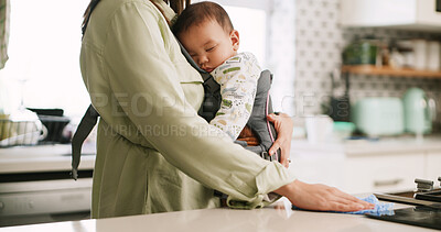 Buy stock photo Baby, cloth and hand of mother in kitchen, wiping counter for chores, cleaning or housework. Bacteria, dirt or disinfection with busy parent and infant in home together for hygiene or multitasking