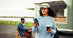 Coffee, food truck and woman with phone outdoor on social media, internet and website on weekend. Customer review, typing and person on smartphone with drink by mobile cafe, restaurant and vendor