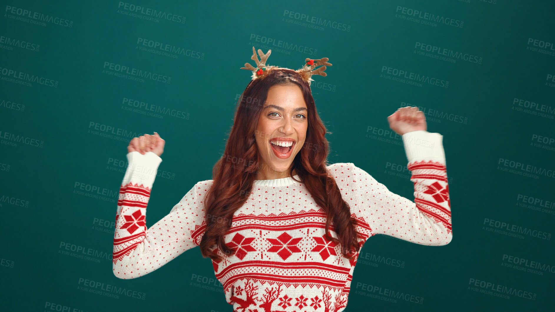 Buy stock photo Christmas, happy and portrait of woman with dance in studio for tradition, festive or celebrate. Smile, antlers and face of female person from Colombia with rhythm for xmas party by green background.