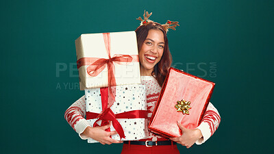 Buy stock photo Christmas, portrait and happy woman with presents in studio for holiday celebration with space. Smile, person and many gifts for xmas, festive tradition or laugh with giveaway box on green background
