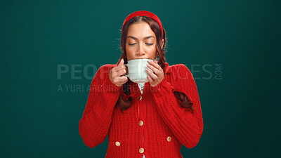 Buy stock photo Studio, woman and drinking hot chocolate for Christmas and beverage for winter, December or holiday. Green background, enjoy and person with warm cocoa, festive season or celebration with  Xmas mocha
