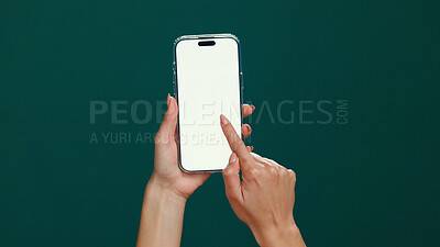 Buy stock photo Hands, cellphone and woman in studio, screen and social media on green background. Internet, mockup space and person with smartphone, app and connection with network, email and message to contact