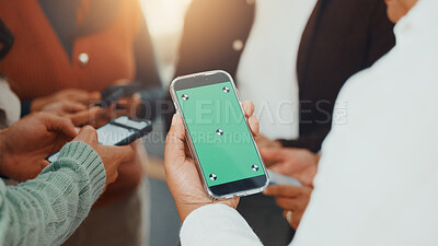 Buy stock photo Green screen, hands and phone with business people in circle at work for communication or networking. Huddle, information transfer and mobile with employee team in office together for connectivity