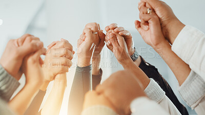 Buy stock photo Holding hands, teamwork and business people in office, support and achievement with profit growth. Employees, closeup and group in workplace, gesture and celebration with cooperation and investment