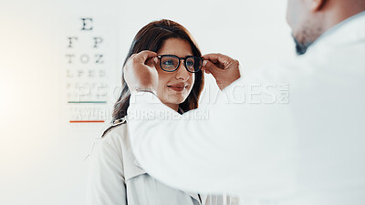 Buy stock photo Vision, optometry and glasses with patient and doctor for eye care, results and consulting. Healthcare, ophthalmology and advice with woman in clinic for exam, eyesight and new prescription or frame