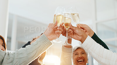 Buy stock photo Hands, champagne toast and celebration at office, achievement or low angle for drinks at company. Business people, glass and team with alcohol, success or sparkling wine for profit increase at agency
