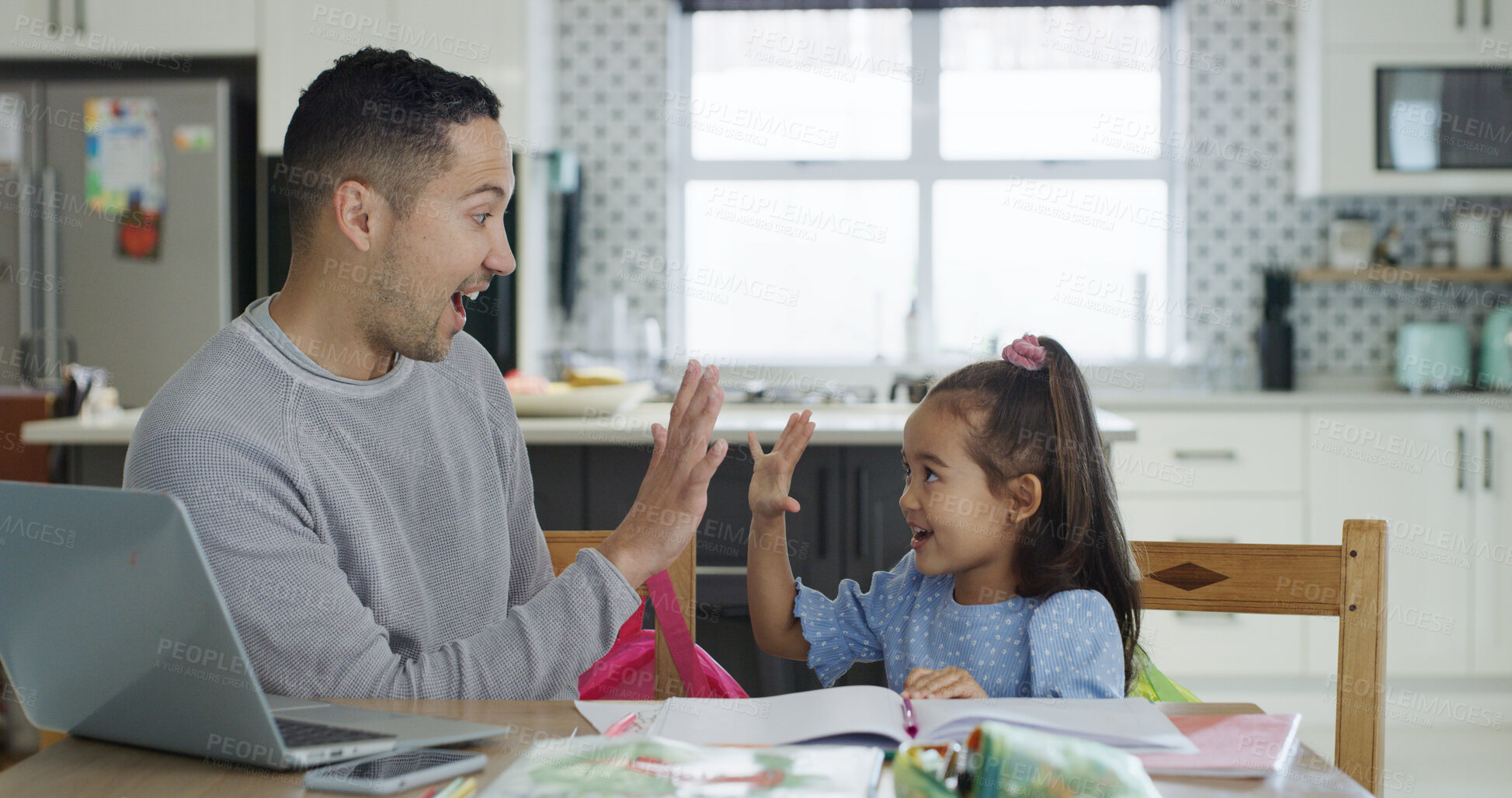 Buy stock photo High five, laptop and father with kid for homework in kitchen for education, learning or help. Happy, celebration and dad with girl child for correct answer on school assessment together in house.