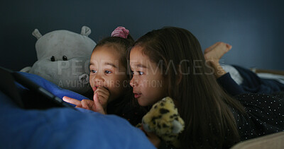 Buy stock photo Relax, night and tablet with kids in bed for streaming, education games or bonding. Learning subscription, connection and sisters or girls in bedroom for family home for child development and bedtime