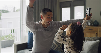 Buy stock photo Winning, video game and father with child in home cheering with energy, bonding or happiness for fun. Smile, excited and dad with girl kid for celebration with online gaming with controller in house.