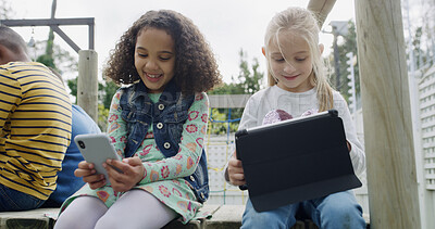 Buy stock photo Friends, girls and smile with technology in garden for social media, fun and break in backyard. Children, together and bonding with phone, tablet and internet for holiday in park with games or meme