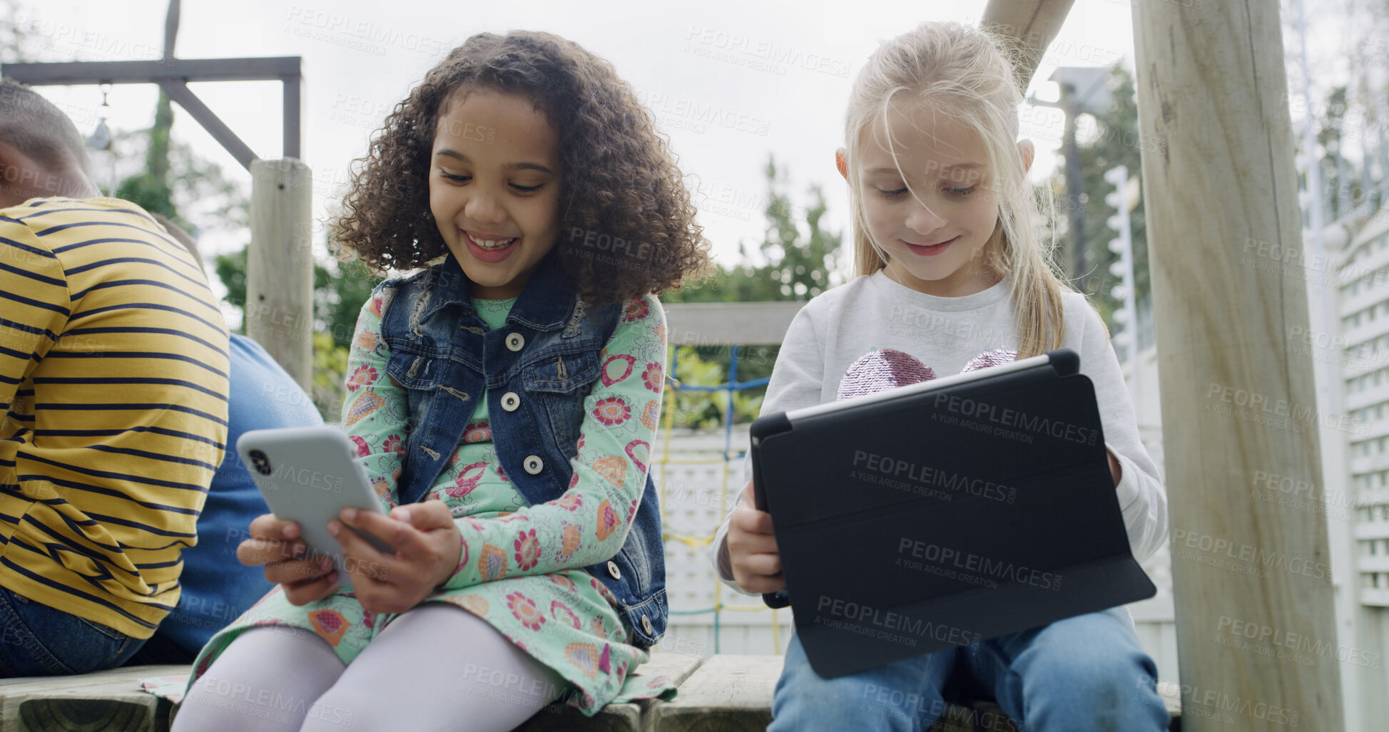 Buy stock photo Friends, girls and smile with technology in garden for social media, fun and break in backyard. Children, together and bonding with phone, tablet and internet for holiday in park with games or meme