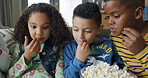 Children, friends and watching movie with popcorn on sofa for entertainment, cartoons and bonding. Living room, people and relax with snack in home for kids show, educational series and weekend break