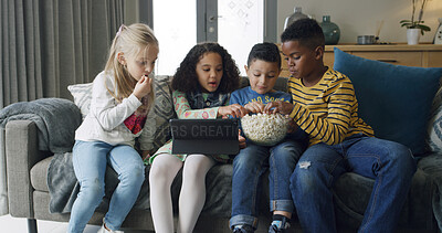 Buy stock photo Eating, popcorn and children with tablet, lounge or watching cartoons with friends or entertainment. Chilling, group and kids with snack for movies, subscription or streaming on website in house