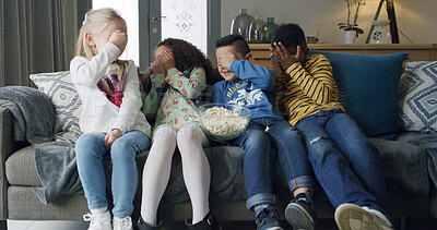 Buy stock photo Popcorn, scared and watching tv with children on sofa in living room of home together for bonding. Covering eyes, eating and television streaming with group of friends in apartment for horror movie