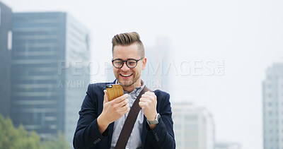 Buy stock photo Fist pump, phone and businessman in city with good news, email or job promotion with happiness. Smile, celebration and male financial manager with cellphone for investment approval in urban town.