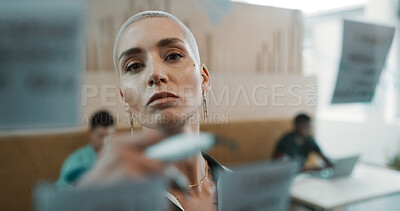 Buy stock photo Creative woman, writing and glass wall for planning, brainstorming and sticky notes strategy in office. Business owner, entrepreneur face and mood board for goals, project thinking or proposal