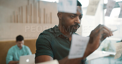 Buy stock photo Business man, writing and glass for planning, ideas or schedule with project management in office. Brainstorming, strategy and employee by board for calendar, agenda and research notes at workplace
