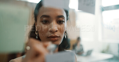 Buy stock photo Woman, face and writing on glass for planning in office, strategy or schedule with project management. Research notes, brainstorming and person with proposal goals, info and vision in workplace