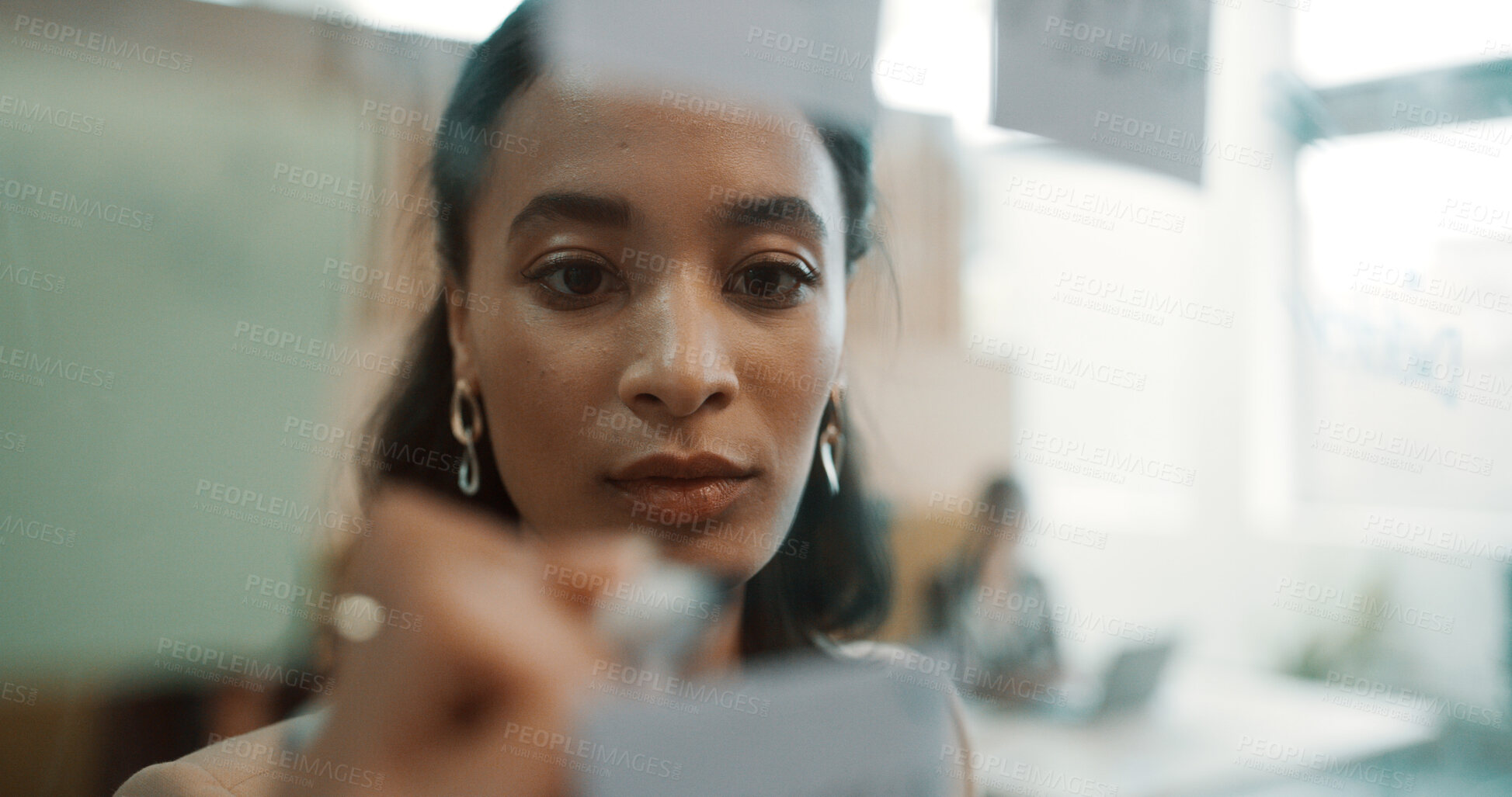 Buy stock photo Woman, face and writing on glass for planning in office, strategy or schedule with project management. Research notes, brainstorming and person with proposal goals, info and vision in workplace