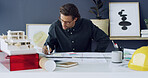 Man, architect and writing on blueprint in office for sketch, building ideas and design process. Male person, 3d model and floor plan information, project planning and notes for property development