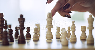 Buy stock photo Chess, strategy and contest with hand of woman in home for relax, problem solving and challenge. Checkmate, tournament and versus with person and king piece on chessboard for hobby and competition