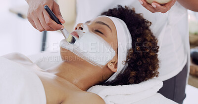 Buy stock photo Hand, brush and woman for face mask at spa, beautician and client with self care, skincare and wellness. Clay facial, treatment and beauty with antiaging, moisturizing and skin detox at health resort
