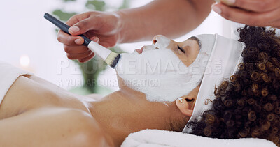 Buy stock photo Face, brush and hand with mask at spa, beautician and woman with self care, skincare and wellness. Clay facial, treatment and beauty with antiaging, moisturizing and skin detox at health resort