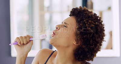 Buy stock photo Brushing teeth, mic and singing with woman in bathroom of home for energy, fun or hygiene. Cleaning, oral care and toothbrush with passionate African person in apartment for dental satisfaction