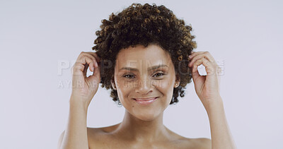 Buy stock photo Curly, hair and portrait with woman in studio for shampoo satisfaction or treatment results. Afro, beauty and growth with smile of happy African person isolated on white background for haircare