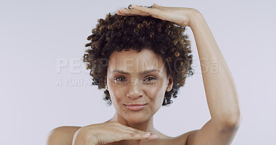 Buy stock photo Woman, hand frame and skincare in studio portrait with afro, confident or pride on white background. Girl, smile and results with dermatology, cosmetics and beauty with natural makeup in Costa Rica