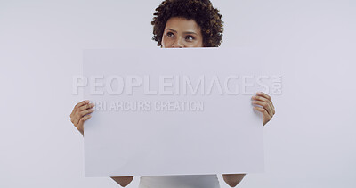 Buy stock photo Girl, blank poster and thinking in studio with announcement, mock up space and afro on white background. African woman, model and board for advertising sale, marketing and sign for deal promotion