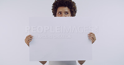 Buy stock photo Woman, blank poster and thinking in studio, announcement or mockup space with afro on white background. African girl, model and board for advertising sale, promotion and marketing for deal with sign