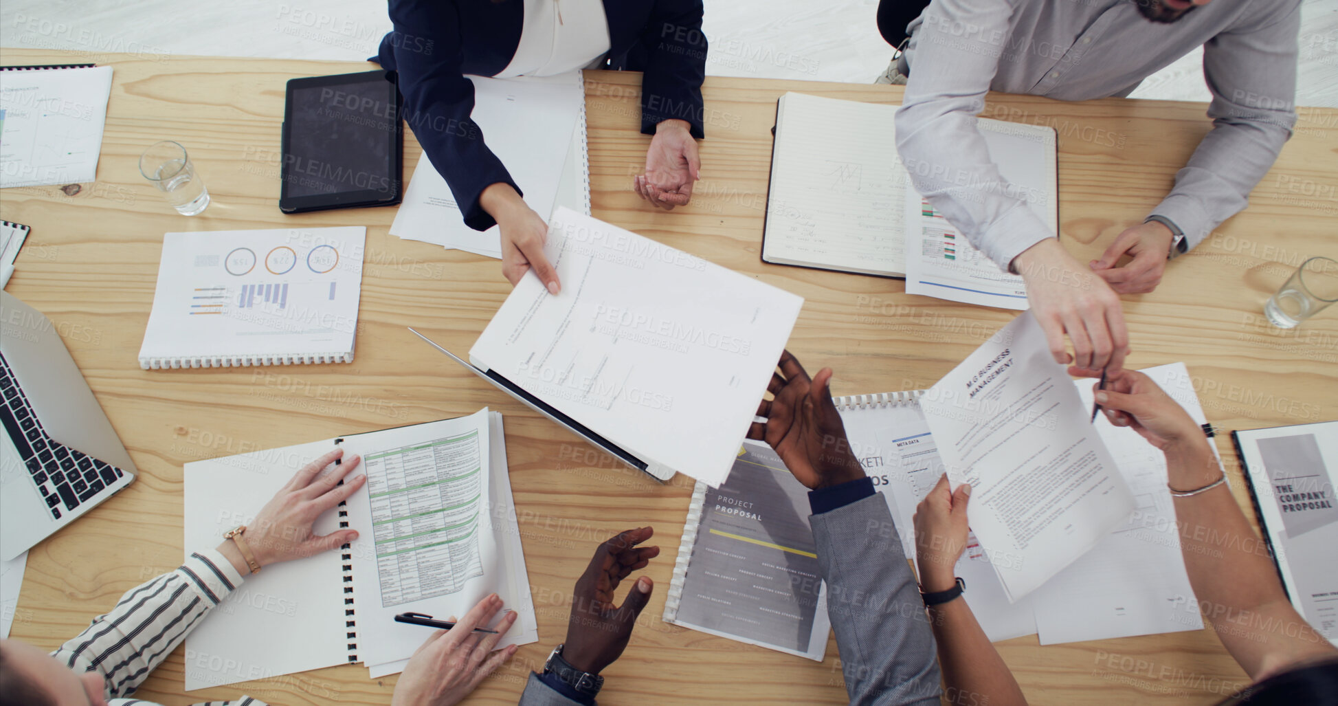 Buy stock photo Above, meeting and hands of business people with documents for planning finance review or strategy. Corporate, office and team of workers with paperwork, research and financial report for proposal