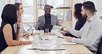 Collaboration, documents and meeting with business people in boardroom of office for discussion. Conversation, paperwork and project management with employee group at work for planning or teamwork