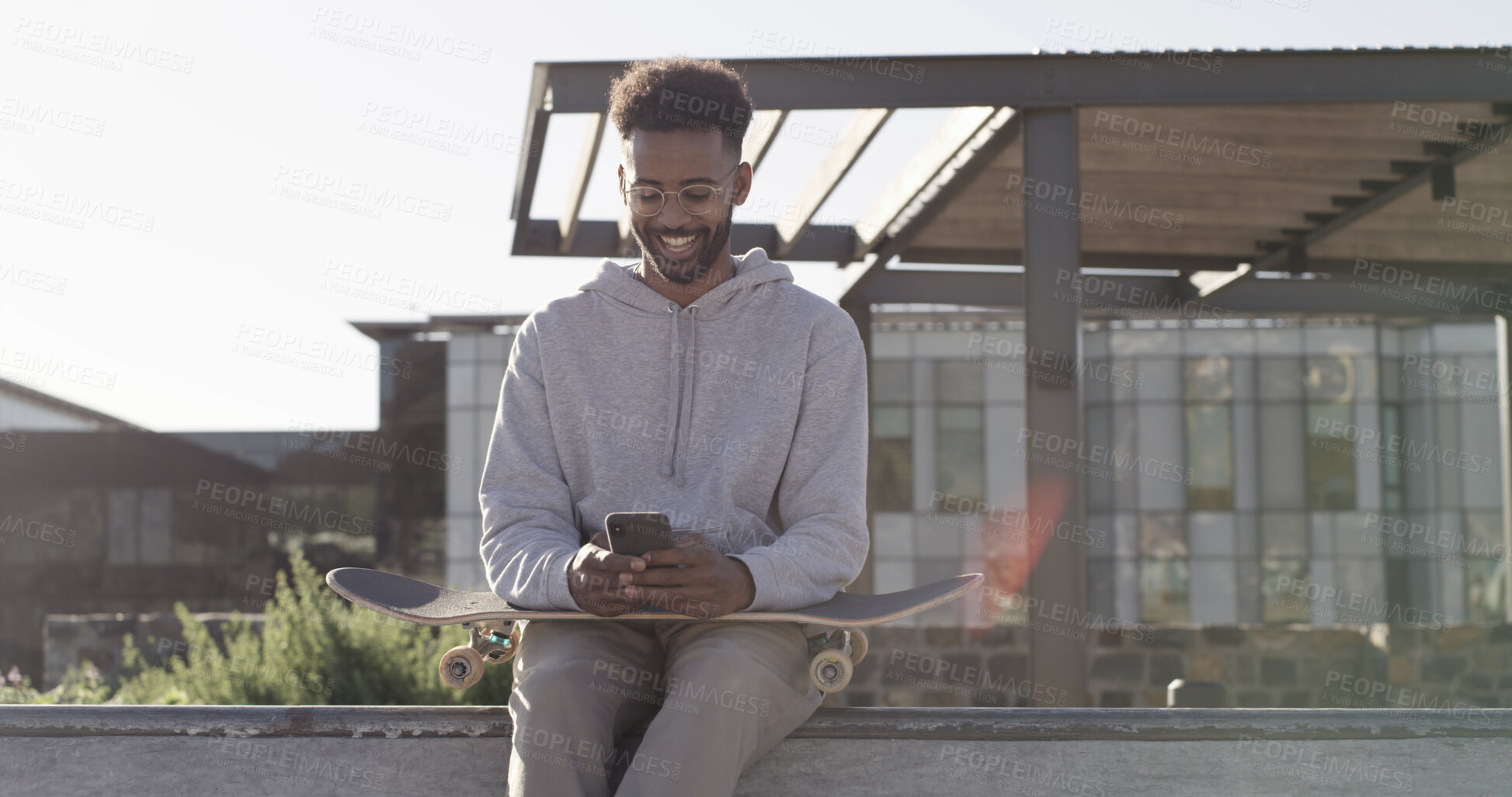 Buy stock photo Skater, man or happy with phone in city for text message, check skating schedule or sports research. Skateboard, person and smartphone outdoor for internet browsing, social media and practice break