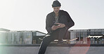 Skater, man and typing with phone in city for text message, check skating schedule or social media. Skateboard, person or smartphone at skatepark for internet browsing, app download or practice break