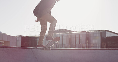 Buy stock photo Legs, skateboard and ramp at park, city and sky with space for balance, exercise and outdoor in summer. Person, skater and feet with training for competition, contest or challenge with extreme sports